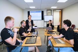 24859956-dr-phan-ho-with-her-students-300x200.jpeg